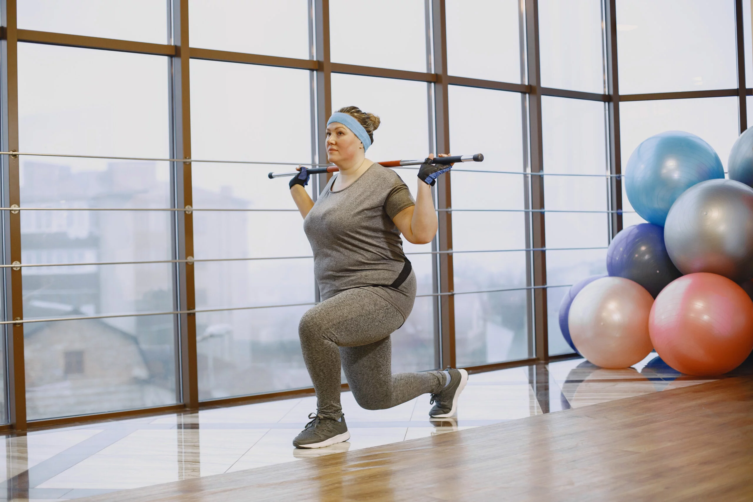 Fat woman dieting, fitness. Portrait of obese woman working out in gym.
